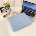 Sky blue quilted 14-inch laptop sleeve with contrasting pink pleated handle - Horizontal Blue
