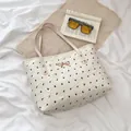 Bolso tote blanco crema con motivos de lazos negros y hebilla metálica dorada - Blanco