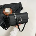 Elegant black litchi pattern shoulder bag with a silver rectangular metal buckle - Black