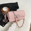 Pink lychee texture shoulder bag with silver buckle and stylish chain strap - Pink