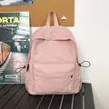 Sac à dos rose clair en nylon à texture quadrillée avec logo brodé pour l'été - Rose