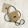 Borsa a secchiello in paglia bicolore beige con tracolla in pelle nera e inserto - Nero