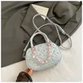 Light blue quilted mini bowling bag with pink beaded chain and adjustable shoulder strap - Blue with Pendant