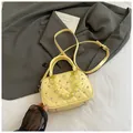 Quilted yellow crossbody bowling bag with diamond studs and beaded handle detail - Yellow with Pendant