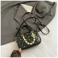 Chic black quilted bowling bag with silver studs and decorative beaded charm - Black With Pendant