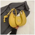Minimalist yellow crescent underarm bag in litchi grain leather with metal logo - Yellow