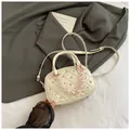 White quilted bowling bag with pink beaded chain and metallic studs on dark blazer - White Without Pendant