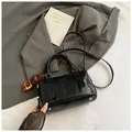 Elegant black crocodile texture bowling bag with cute teddy bear charm for women - Black With Pendant