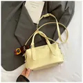 Creamy yellow croc-embossed bowling handbag with cute brown plush bear charm - Yellow with Pendant
