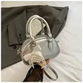 Silver pleated bowling handbag with lace bow pearl charm and crossbody strap - With Charm / Silver