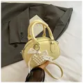Pale yellow mini bowling bag with lace bow and pearl heart charm on a soft fabric - With Charm / Yellow