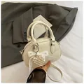 Chic beige pleated bowling handbag with pearl heart charm and bow detail for women - With Charm / White