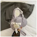 Purple textured leather bowling bag with pearl heart charm and lace bow detail - With Charm / Purple