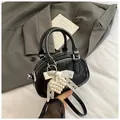 Black glossy patent leather bowling bag with pearl heart and lace bow detail - With Charm / Black