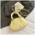 Pale yellow wrinkled PU leather bowling bag with silver hardware and adjustable strap - No Pendant / Yellow