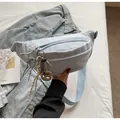 Corduroy chest bag in light blue with adjustable strap and decorative biscuit pendant - With Ornament / Blue