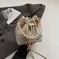 Beige floral jacquard bucket bag with pearl handle and chain strap for women - Beige