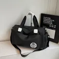 Grande borsa tote nera impermeabile con manici bianchi e tracolla per sport e viaggi - Nero