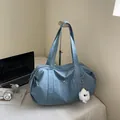 Blue nylon tote bag with large capacity, snap pocket, and plush pendant for daily commute - Blue Without Charm