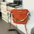 Vibrant orange nylon crossbody bag with rope handle and woven strap detail - Orange
