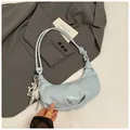 Light blue half-moon crossbody bag with pleated texture and silver star charm - Star Pendant Included / Blue
