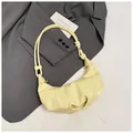 Pale yellow crescent dumpling bag with pleated texture and knotted shoulder strap - No Pendant / Yellow
