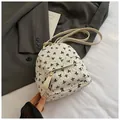 Mini sac à dos blanc pour femme avec motifs jacquard à nœuds noirs et bretelles en cuir - Blanc