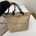 Borsa tote in paglia beige chiaro con manici in corda nera e ricamo per l'estate - Nero