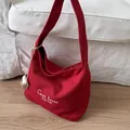 Red canvas tote bag with white embroidery and knot charm in a large hobo style - Red