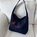Dark blue canvas tote bag with red 'C'est la vie' embroidery and mini red charm - Navy Blue