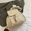 Mochila de lona beige con bordado amarillo y cordón bicolor rojo y blanco - Blanco Roto