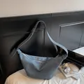 Gray crescent moon shoulder bag in denim fabric with adjustable strap and silver zipper - Blue