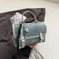 Light blue denim texture crossbody bag with silver buckle and star tassel charm - Silver with Charm