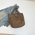 Brown nylon tote bag for women featuring a spacious trapezoidal design and dual straps - Brown