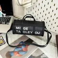 Black cylindrical nylon bag with white letter print and adjustable shoulder straps - Cylindrical / Black