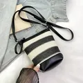Minimalist black and white striped woven bucket bag with black leather base detail - Black