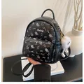 Black mini floral backpack with cute bow patterns and a plush charm detail - With Charm / Black