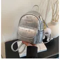Chic silver mini floral backpack with metallic texture and plush charm accessory - With Charm / Silver