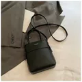 Minimalist black bucket handbag with dual handles and adjustable strap in French style - Black without Pendant
