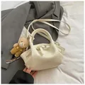 Creamy crocodile pattern dumpling handbag with plush bear charm and crossbody strap - With Charm / White