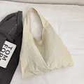 Chic beige canvas tote bag with textured crinkle fabric and wide shoulder strap - Off White