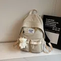 Zaino beige minimalista in nylon per studenti con doppie tasche frontali e ciondolo orso - Con Ciondolo / Bianco Sporco