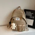 Minimalist khaki backpack with cute bear pendant and stylish square logo label - With Charm / Khaki