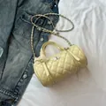 Beige quilted cylinder shoulder bag with lace bow and gold chain strap - Yellow