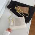 Vertical striped cream crossbody bucket bag with gold chain and puppy charm - Off White