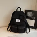 Black minimalist nylon backpack with waswac rules patch and multiple utility pockets - No Pendant / Black
