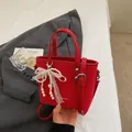 Fashion red bucket bag for women with pearl lace pendant and adjustable shoulder strap - Wine Red With Pendant