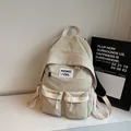 Minimalist beige nylon backpack with double front pockets and adjustable straps - No Pendant / Off-white