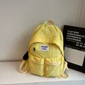 Minimalist bright yellow nylon backpack with white adjustable drawstring pockets and patch - No Pendant / Yellow