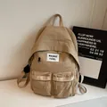 Minimalist khaki nylon backpack with double front pockets and aesthetic label branding - No Pendant / Khaki